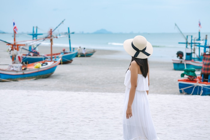 summer-travel-vacation-concept-happy-traveler-asian-woman-with-dress-straw-hat-walking-sea-beach-hua-hin-thailand (Copy).jpg